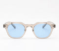 Tidal sunglasses in translucent smoke taupe with pale blue lenses