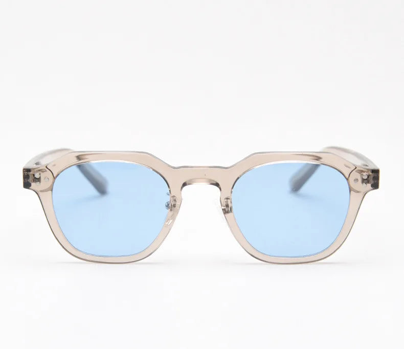 Tidal sunglasses in translucent smoke taupe with pale blue lenses